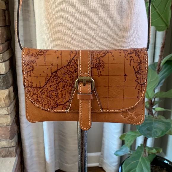 Patricia Nash Handbags - Patricia Nash leather crossbody with world map and buckle